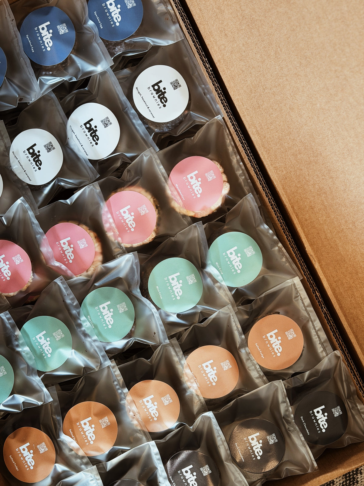 Bulk brownies assorted flavors packaged in a box, ready for parties and gatherings.