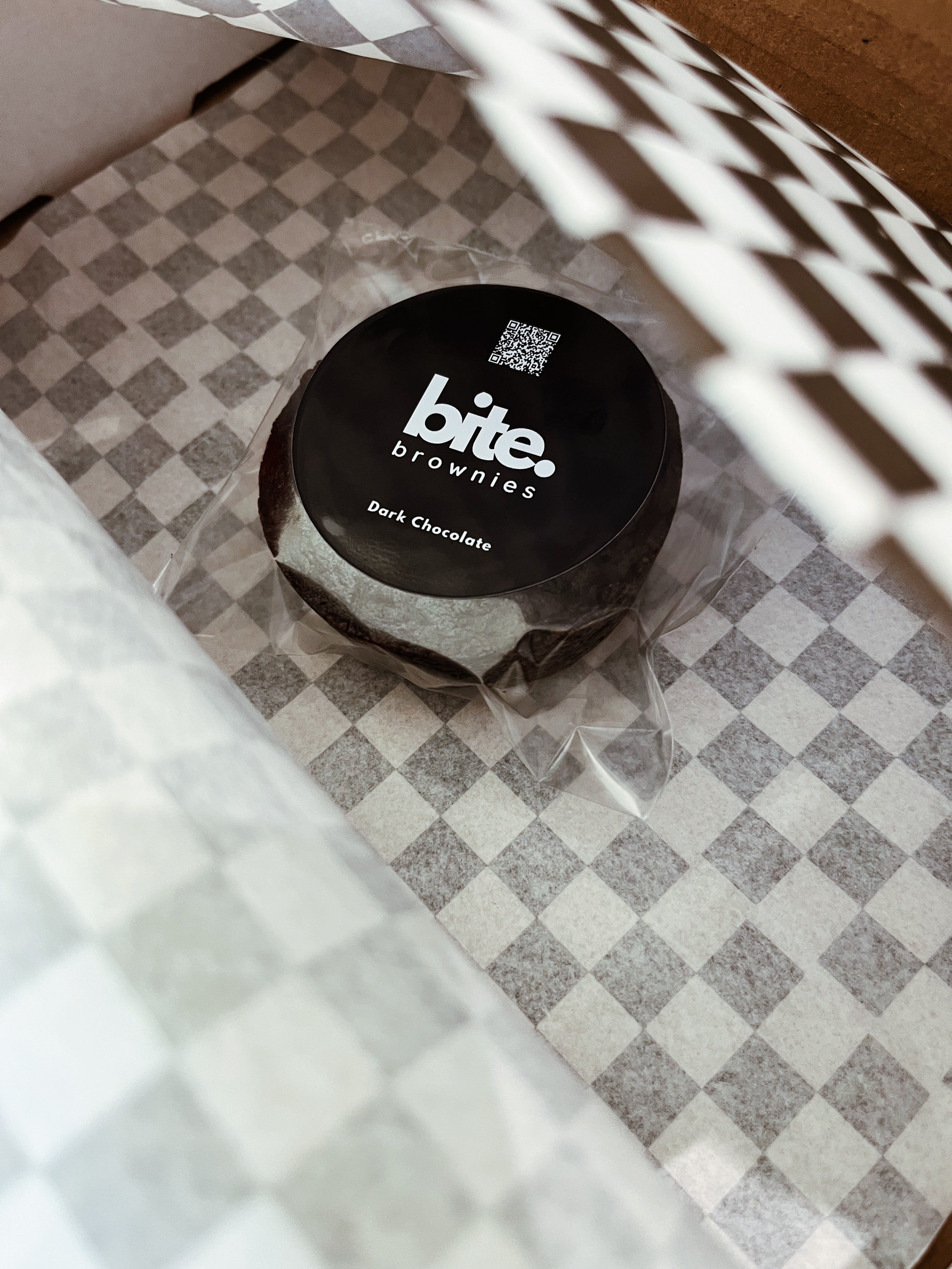 Bite Brownies container on a checkered surface